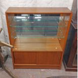 A 91cm retro teak effect display cabinet with glass shelves enclosed by glazed sliding doors, over