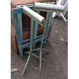 Two metal fabricator's adjustable rollers - sold with two wooden trestles