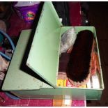 A vintage Tala painted tin shoe cleaning box containing a quantity of polishes, brushes, etc.