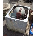 An old galvanised water tank containing a quantity of galvanised pots, etc.