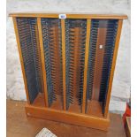 A retro teak effect four section CD rack