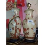 Two ceramic table lamps of vase form decorated with prunus blossom design