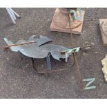 An old copper and wrought iron weathervane depicting a squirrel