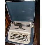 A vintage Royal 'Safari' portable typewriter with beige and ivory livery in original fitted green