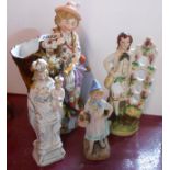 A late 19th Century continental porcelain figural spill vase, a Staffordshire figurine, etc.