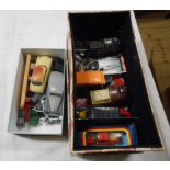 A box containing a quantity of die cast toy vehicles, a row of vintage metal petrol pumps and a