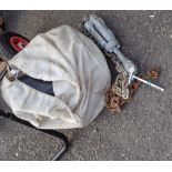 A sack containing a quantity of Seagull Outboard motor parts - sold with an old chain anchor