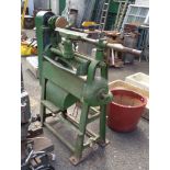 A large vintage Frobana woodworking lathe with green painted cast iron body