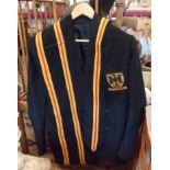 A vintage school blazer with pocket patch and scarves