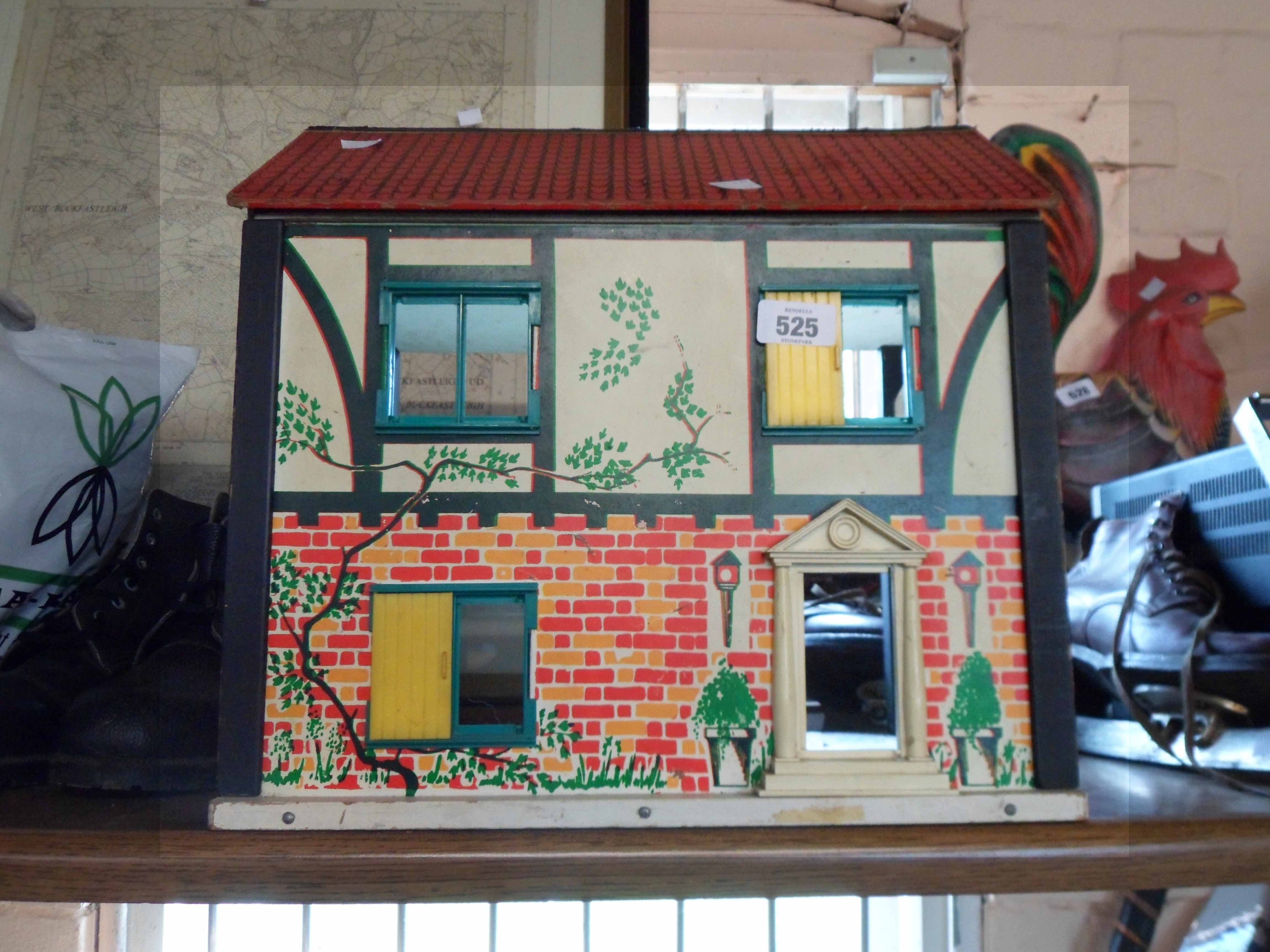 A vintage child's doll house with printed card sides