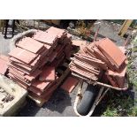 A large quantity of rosemary red clay terracotta roof tiles
