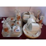 A quantity of ceramic items including dressing table set, cups and saucers, etc.