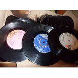 A box containing a large quantity of 45rpm records (without sleeves) including T-Rex, Elvis