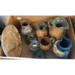 A box containing studio pottery by Leigh Coombes