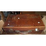 A vintage leather suitcase with painted details Capt. R.W. Rowan R.A.M.C.