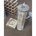 An old garden sundial with octagonal marble column set on pedestal base with tempus fugit around and