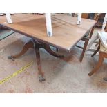 A 1.42m mahogany tilt-top pedestal dining table, set on ring turned pillar and quadruple splayed