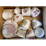 A box containing a quantity of commemorative china including cups and saucers, etc.