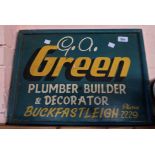 A vintage painted trade sign for G.A. Green, Plumber, Builder & Decorator