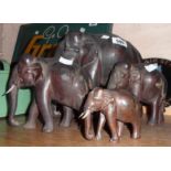 A troop of old carved rosewood elephant figurines