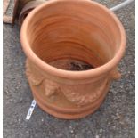 A terracotta plant pot with lion mask and swag decoration - a/f