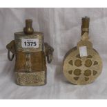 Two Eastern powder flasks comprising one horn with silvered and brass mounts and cast iron rings,