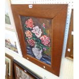 An oak framed oil on canvas still life of roses in a vase - indistinctly signed