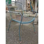 A green painted metal garden armchair