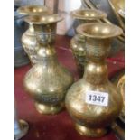 A pair of Eastern brass chased vases with enamelled finish - sold with another similar pair