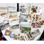 A box containing a collection of early 20th Century and later postcards including local interest,