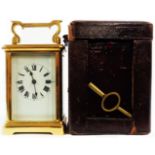 A brass and bevelled glass cased carriage timepiece with French eight day movement and damaged
