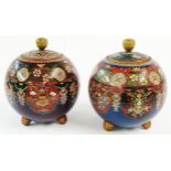 A pair of Japanese Meiji period cloisonne vases and covers of globular form each decorated with