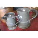 An old pewter tavern pint jug - sold with a similar quart mug