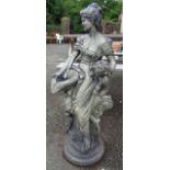 A painted garden fountain in the form of a classical woman with child