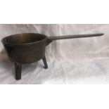 An antique cast bronze three footed skillet pan, the handle marked Wakley. B. WV