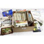 A shoe box containing a large collection of early to mid 20th Century assorted postcards including