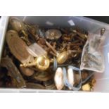 A box containing a quantity of vintage brass and other door handles, casters etc.