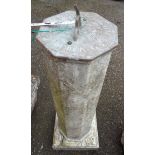 An old garden sundial with octagonal marble column set on pedestal base with tempus fugit around and