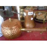 An old beaten copper Turkish coffee pot - sold with a beaten effect copper saucepan with wooden