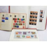 Two Barclay red stamp albums, one containing a collection of mint and used 20th Century GB stamps,