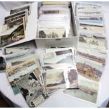 A box containing a large collection of early 20th Century and later postcards including numerous