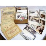A box containing a collection of early and later 20th Century postcards including topographic,