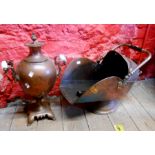 A copper helmet coal scuttle with turned wooden handle (a/f) and associated shovel - sold with a