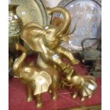 A set of three large hollow cast brass elephant ornaments