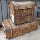 Two vintage canvas trunks with applied luggage labels for the Elder Dempster Line