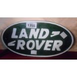 A modern painted cast iron Landrover sign