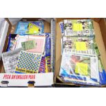 A box containing a collection of Torquay United AFC football programmes from the late 1980's to 2000