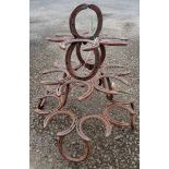 A plant stand formed from horseshoes