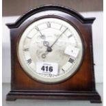 A vintage stained wood cased table timepiece with Smiths eight day floating balance movement