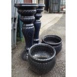 Two modern black glazed jardinieres and stands of wrythen form - various condition